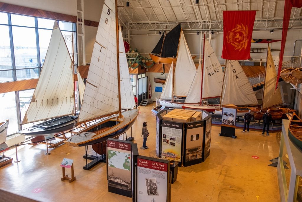 Several large sailboats on display in the Maritime Museum.