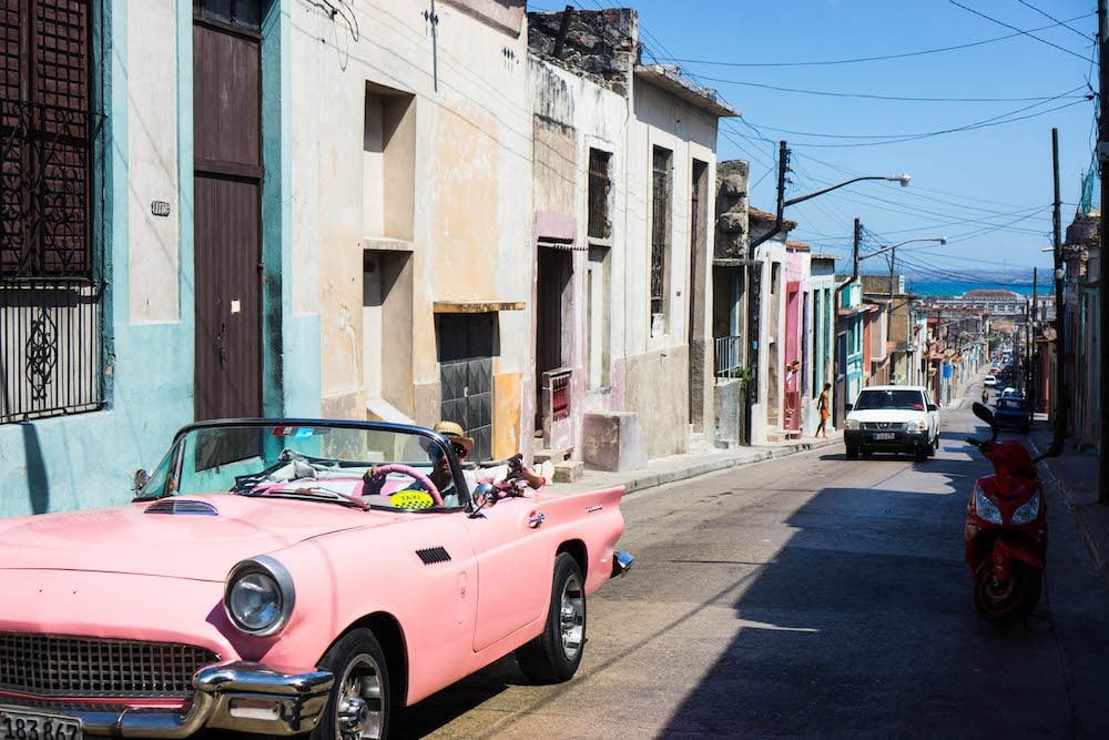 An antique pink convertible on a cuba street in Matanzas