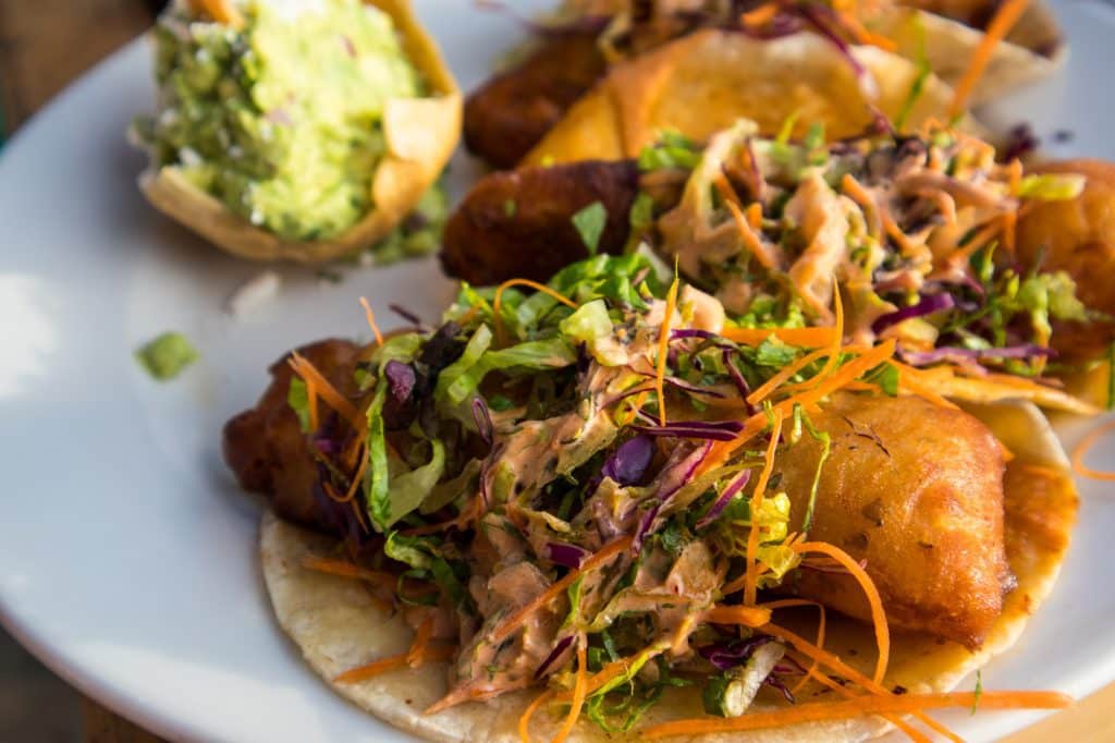 A plate of sumptuous fried fish tacos topped with slaw and salsa in Bucerias.