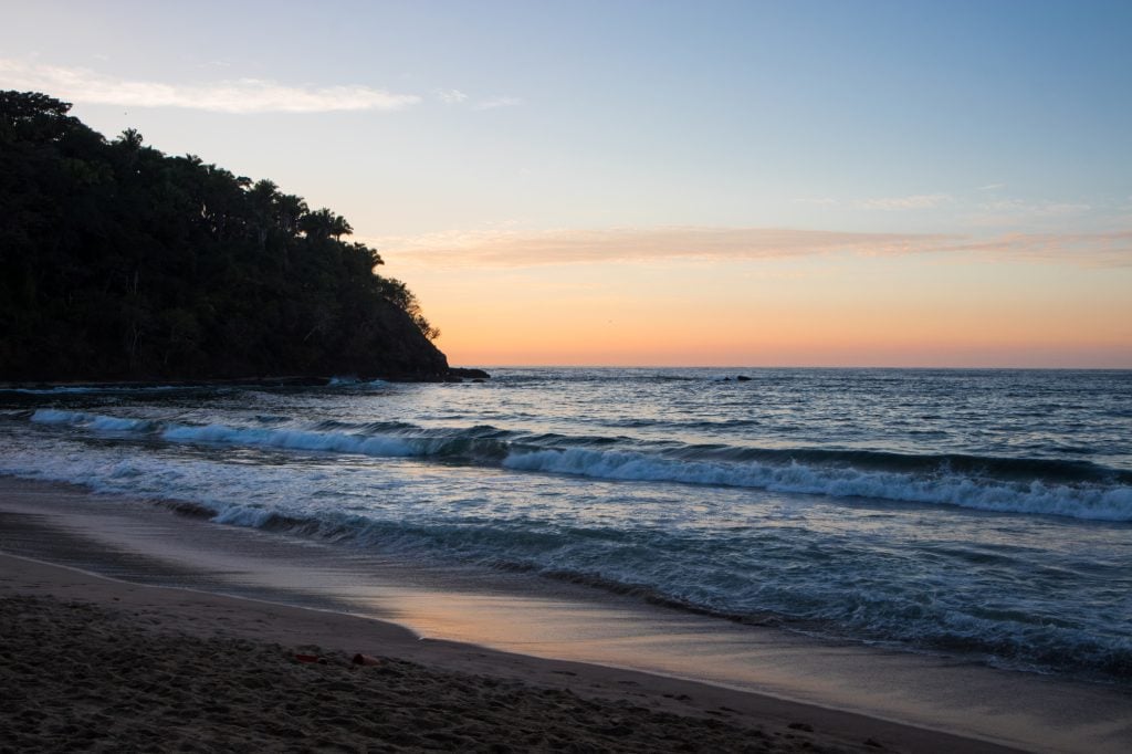 A gentle sunrise in Bucerias, the sky beginning to turn orange atop the blue ocean.