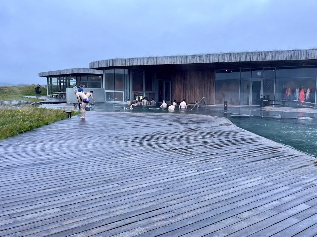 A wide wooden deck next to the pools at the Vok Baths.