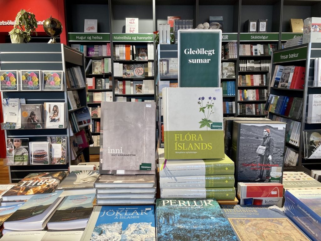 Piles of books about Iceland in an Icelandic bookstore.