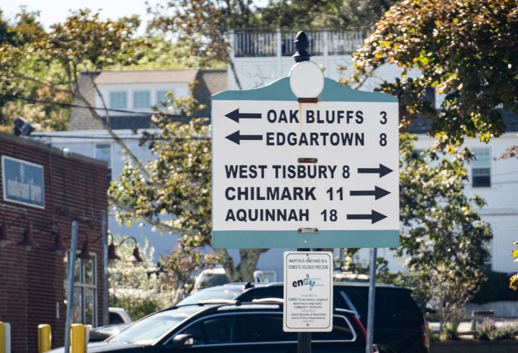 A road sign with arrows pointing to Oak Bluffs, Edgartown, and West Tisbury.