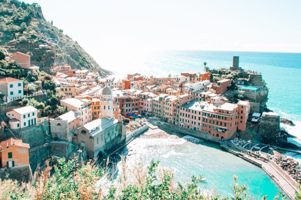 Aerial view of Cinque Terre Italy with a hillside to the right and water to the left