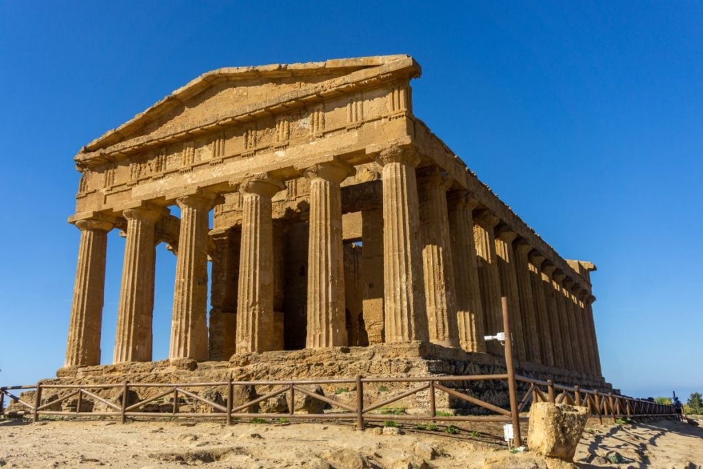 The Temple of Concordia on a bright, blue sky day in the Valley of the Temples Italy