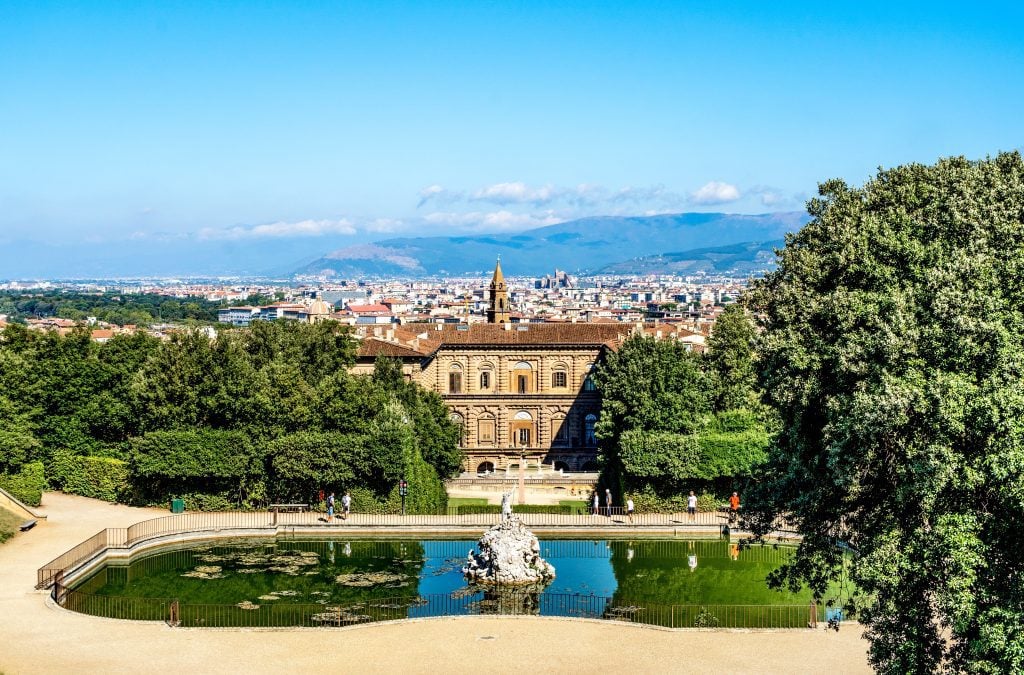 A pond in Boboli gardens with the Pitti Palace in the background