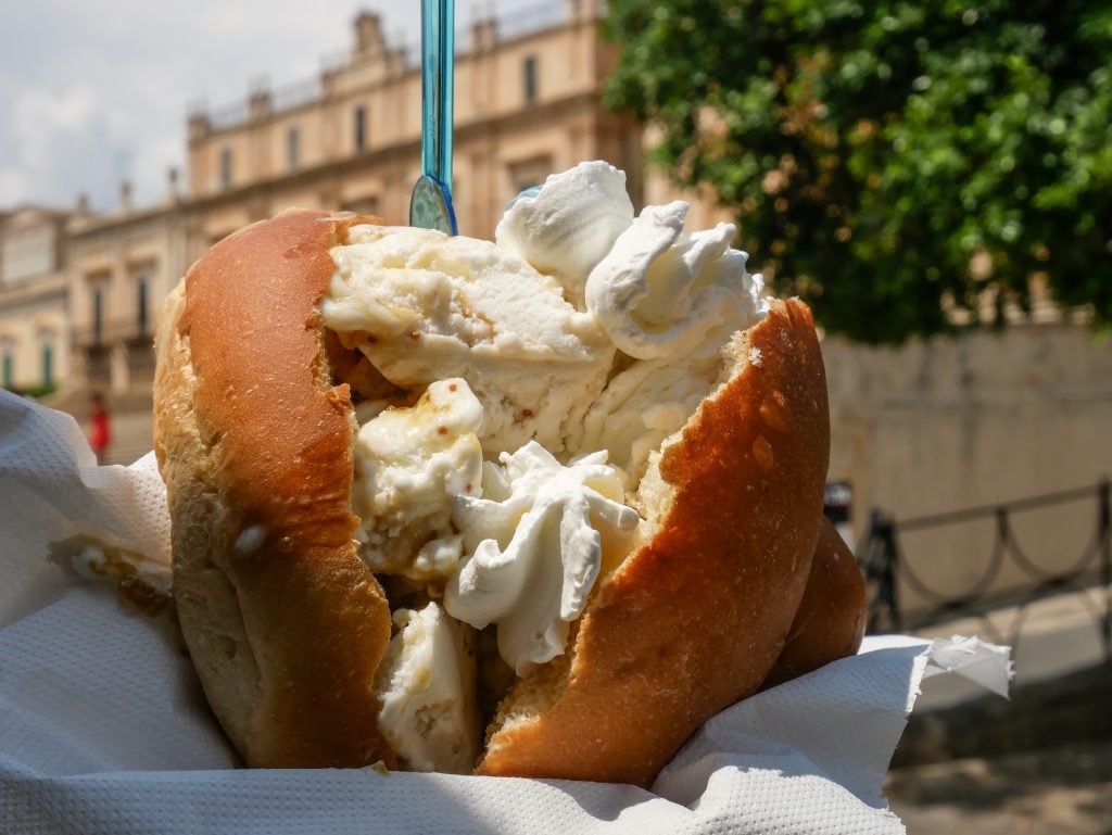 A brioche stuffed with gelato and whipped cream.