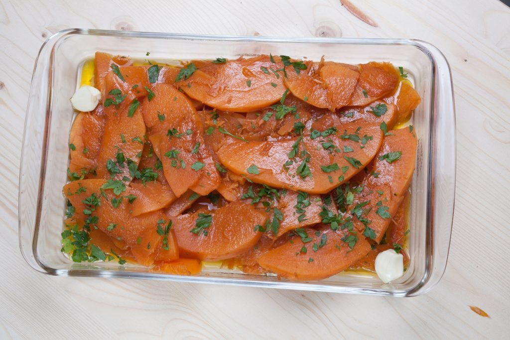 A dish full of sweet and sour pumpkin slices.