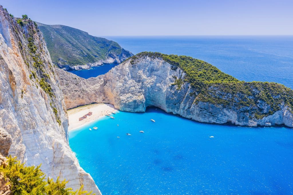 Beautiful sunny coast view to greek beach mediterranean blue sea