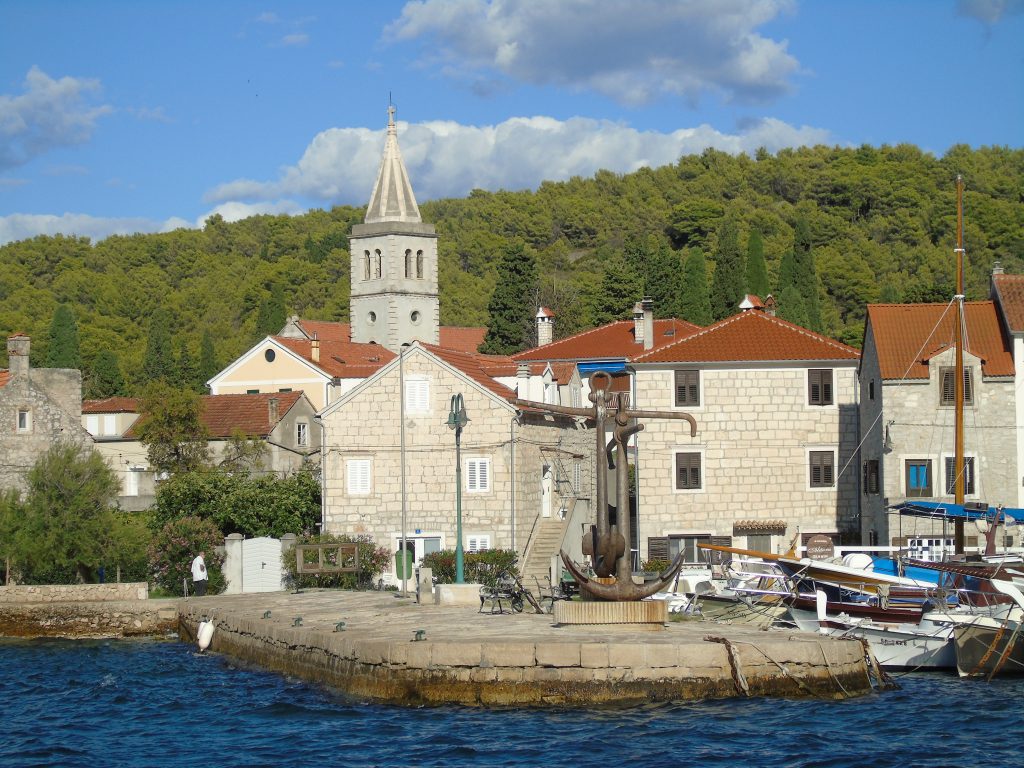 White buildings on Zlarin Island, photo taken from the water