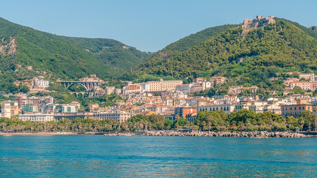 A view of Salerno from the water, with ground hills in the background