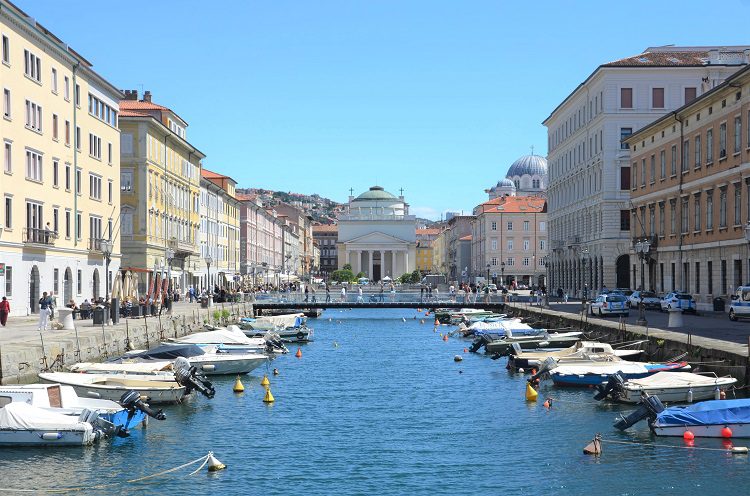 A small port lined with small boats in Trieste Italy