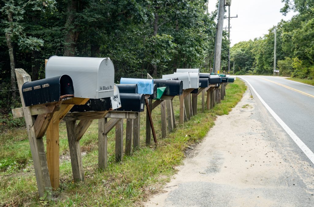 A row of mailboxes on a rural road in Martha's Vineyard.