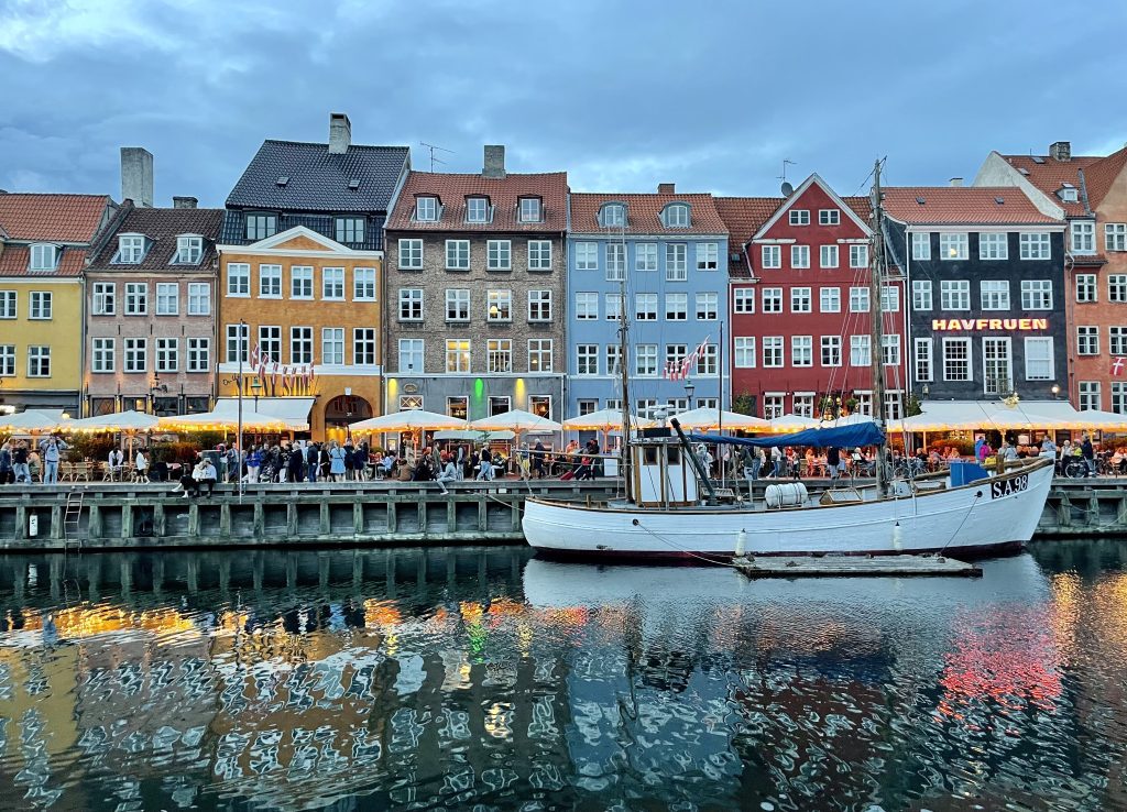 Copenhagen's Nyhavn wharf, with lots of brightly colored buildings along the water.