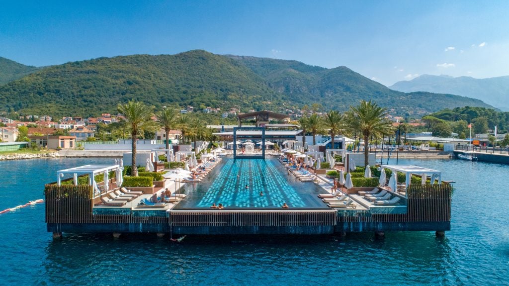 A luxurious pool protruding out above the ocean in Montenegro.