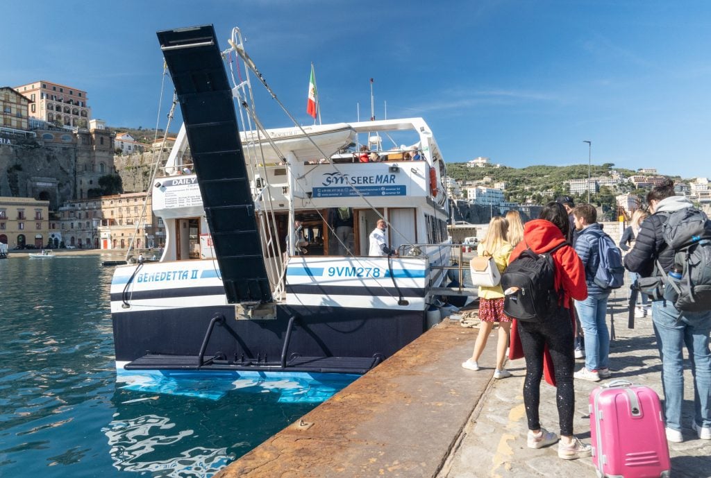 People waiting for a ferry boat to take them from Sorrento to the Amalfi Coast.