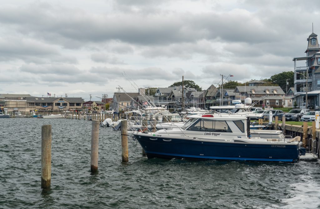 A small speedboat named the Little Dipper docked in the water in Martha's Vineyard.