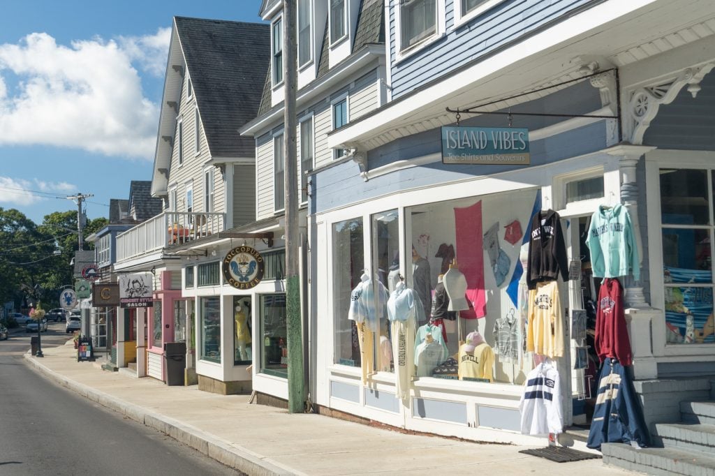 Several boutiques in a row on a quiet street in downtown Oak Bluffs.