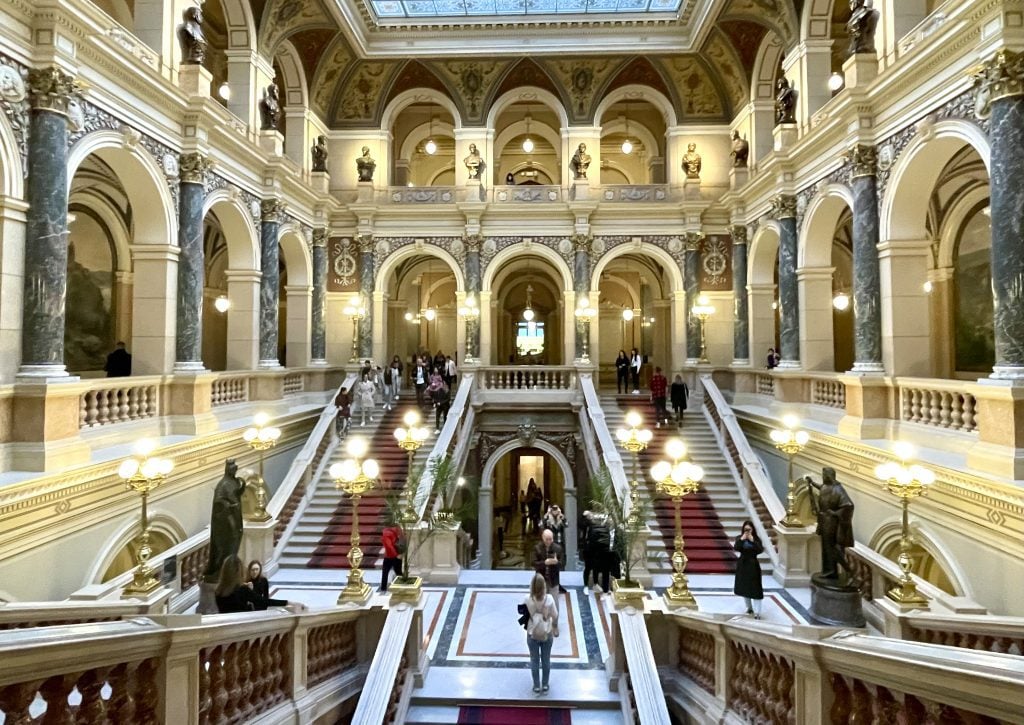 The atrium National Museum, with giant intricate staircases and walls made of marble.