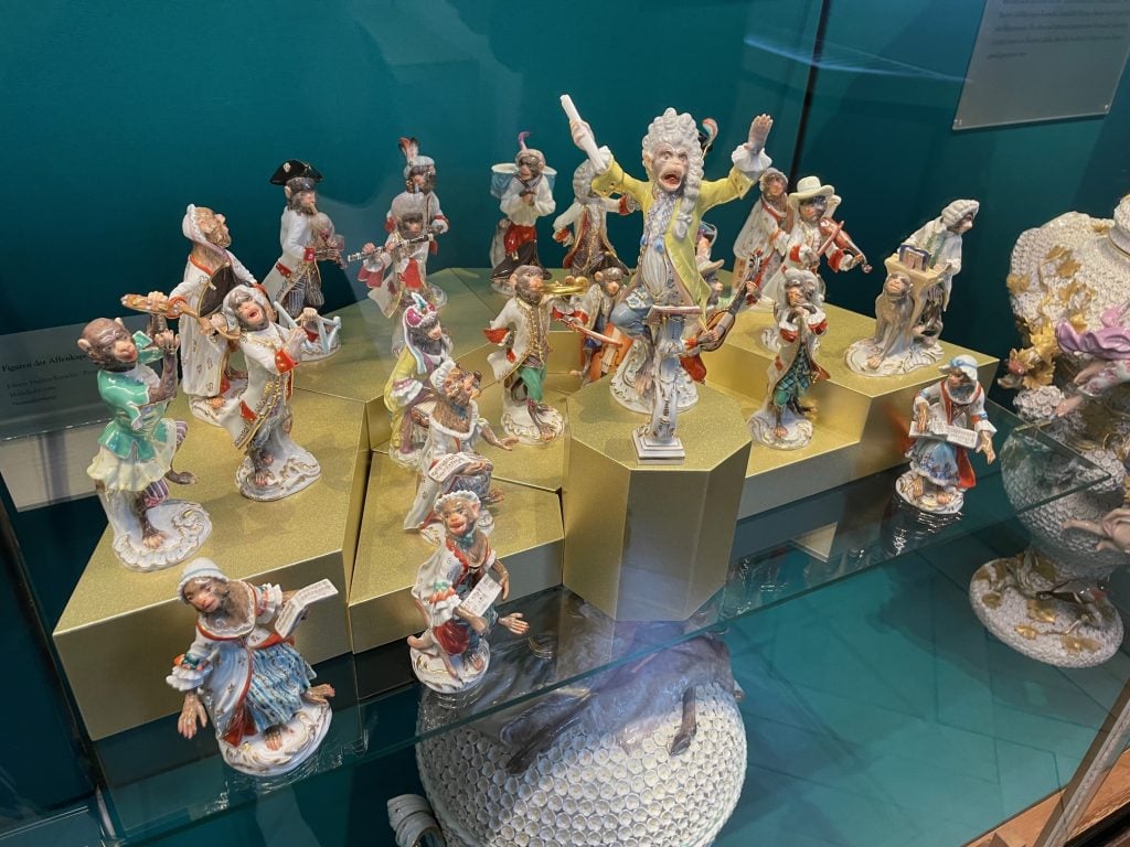 Small porcelain figurines of an 18th century orchestra made up of monkeys. The passionate conductor gives me Mozart in Amadeus vibes.