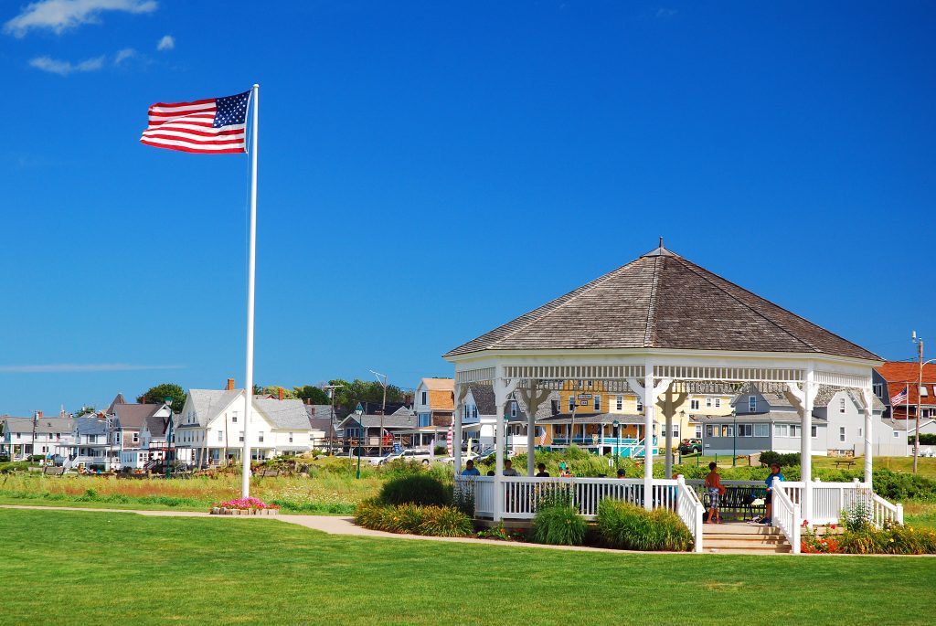 A park in York Maine with a wooden gazebo and a high-flying American flag.