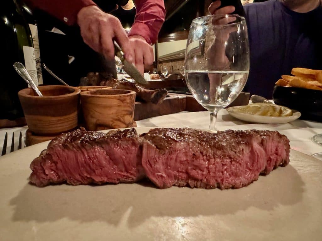 A juicy, rare steak on a plate at Don Julio in Buenos Aires.