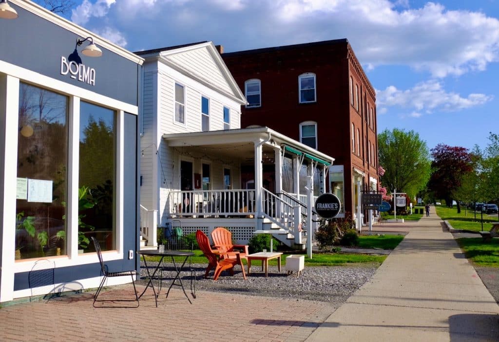 Shops and restaurants lining the street in downtown Lenox Mass.