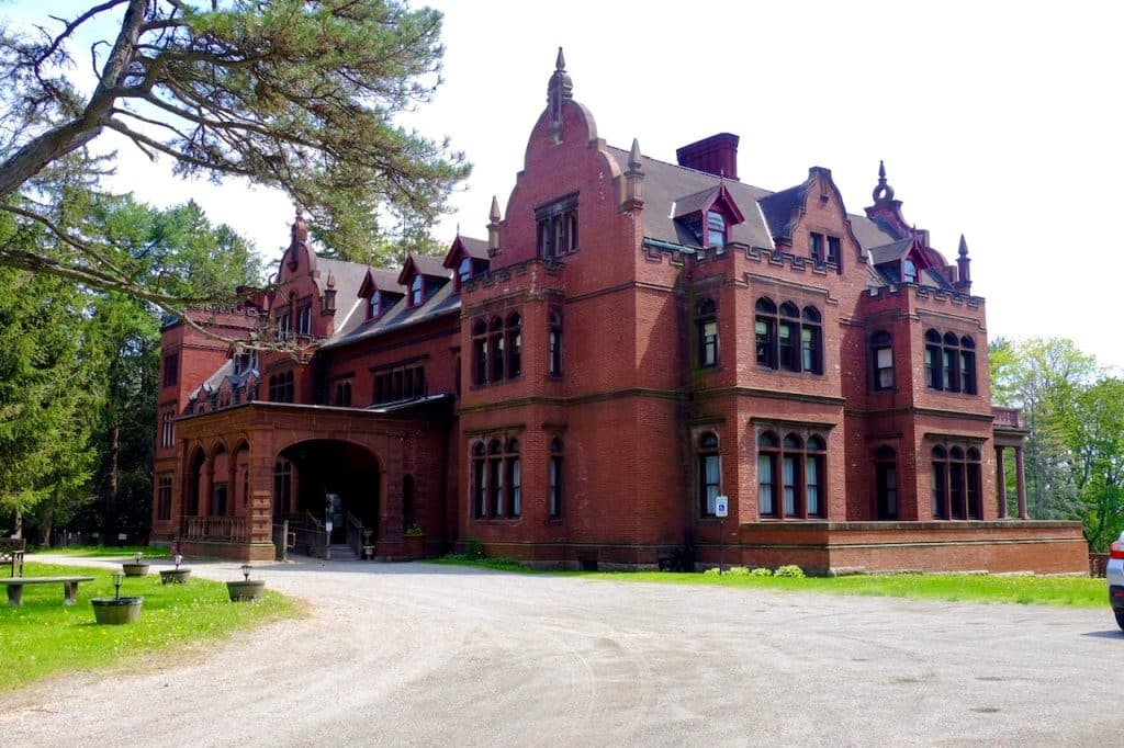 An ornate red brick mansion from the early 1900s.