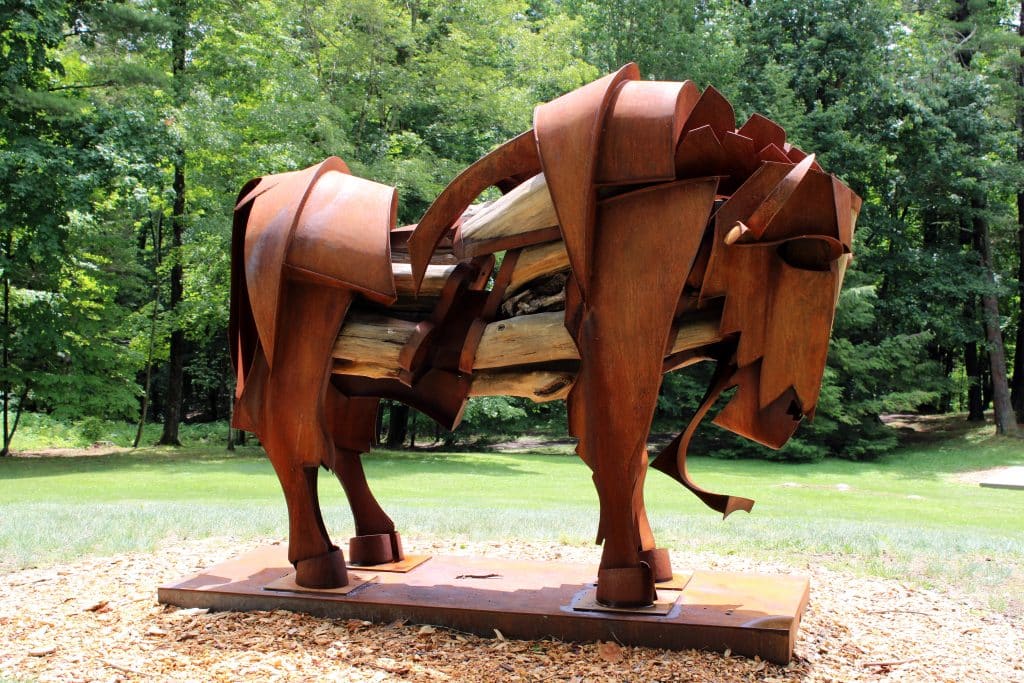 A statue of a horse made of what looks like metal panels.