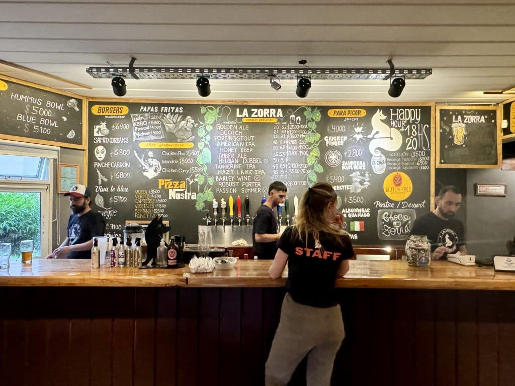 The counter at a brewery in Argentina, the specials written on a chalkboard.