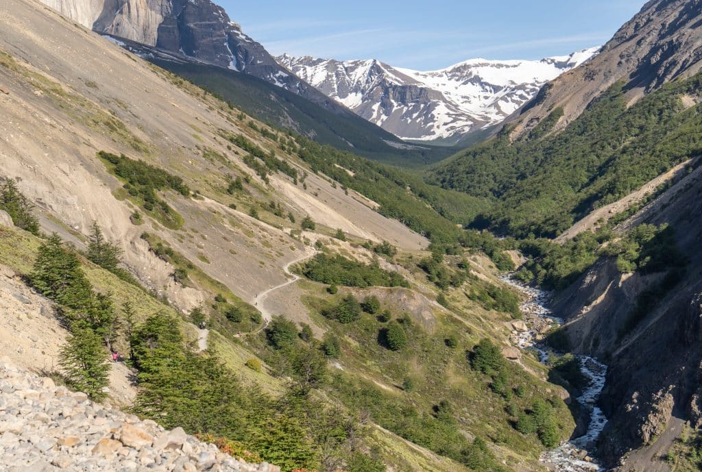 The "windy pass" -- a hiking trail hugging the side of a mountain with no shelter from trees.