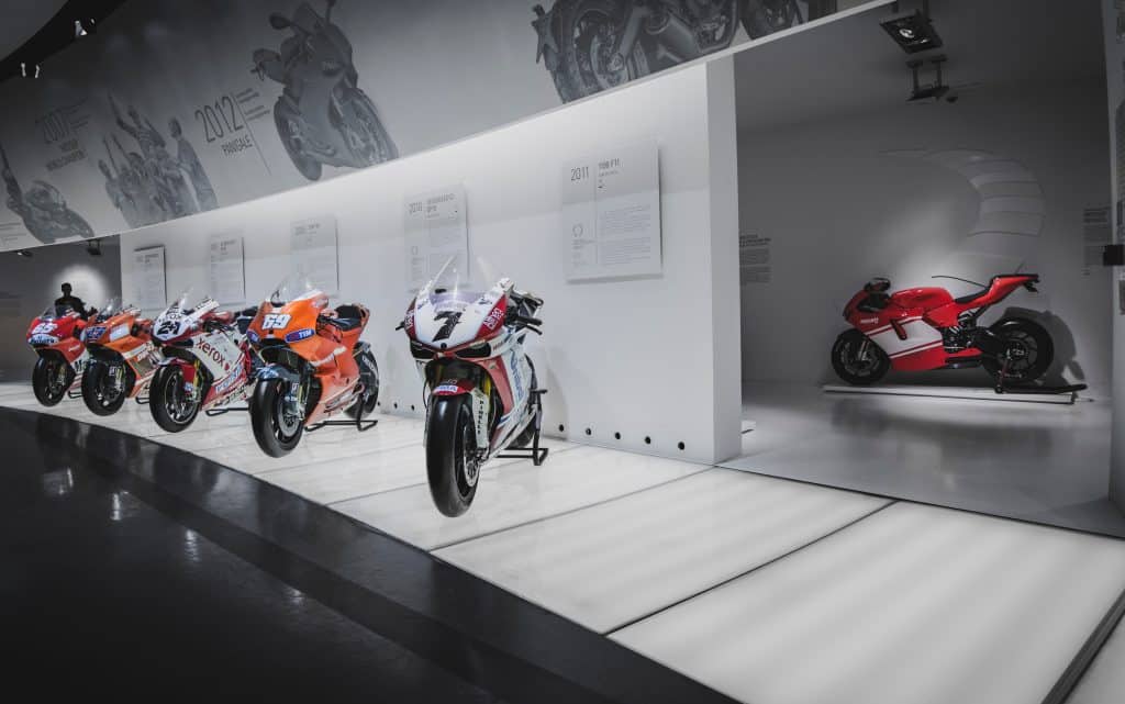 A museum lined with fancy Ducati motorcycles.