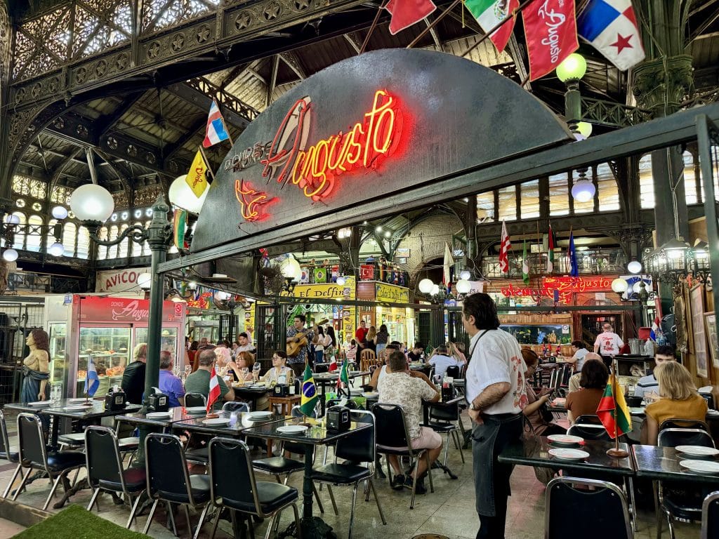 A busy, bustling restaurant at a market in Santiago.