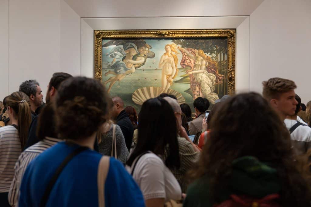 Huge crowds of people clustered around Botticelli's The Birth of Venus at the Uffizi.