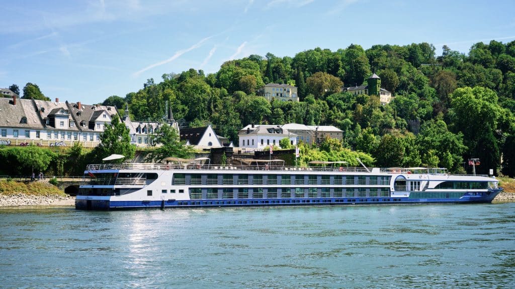 A river cruise boat parked in a small town in Germany