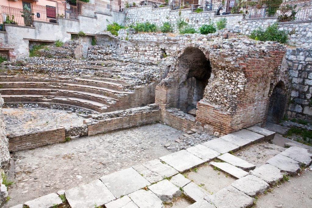A small stone amphitheater falling into disrepair.