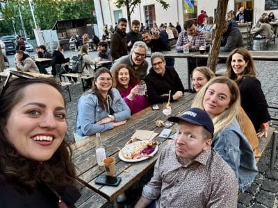 Kate and a group of friends hanging out at an outdoor brewery.