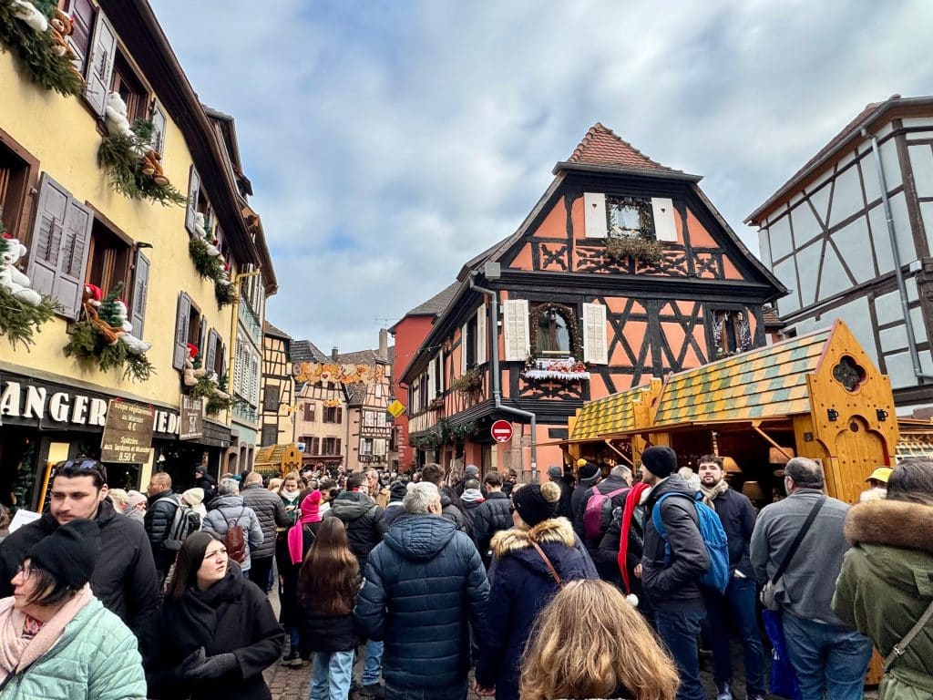 Huge crowds in the brightly colored medieval town of Ribeauville at Christmas.