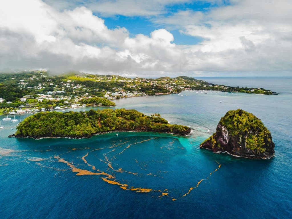 A bird's eye view of a small tropical island.