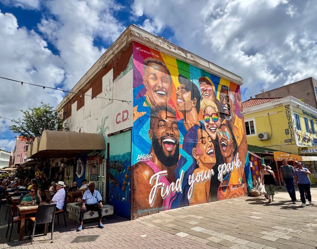 A mural with lots of different faces, and it says Find your spark.