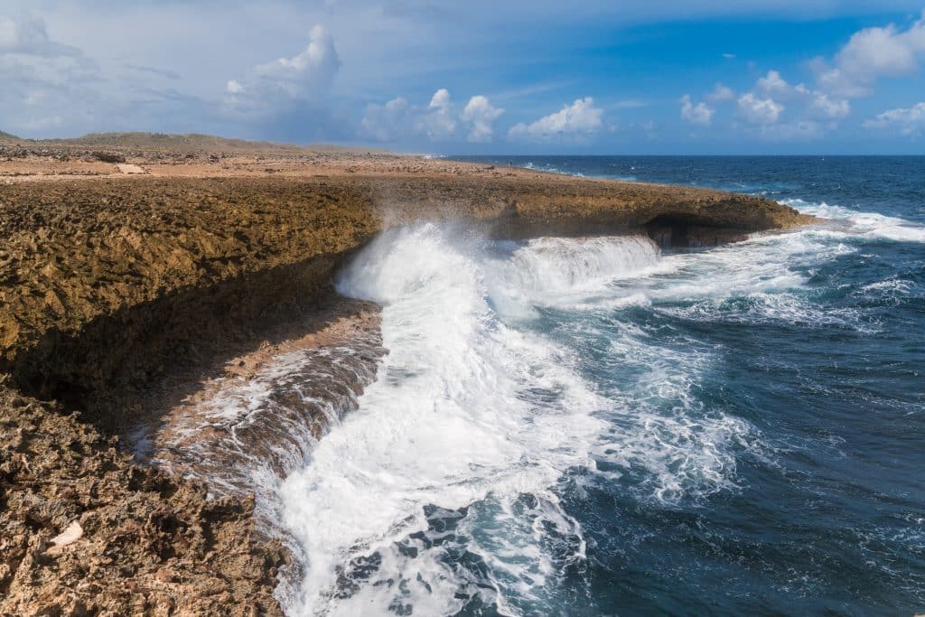 Crashing waves against a cliff in Curacao.