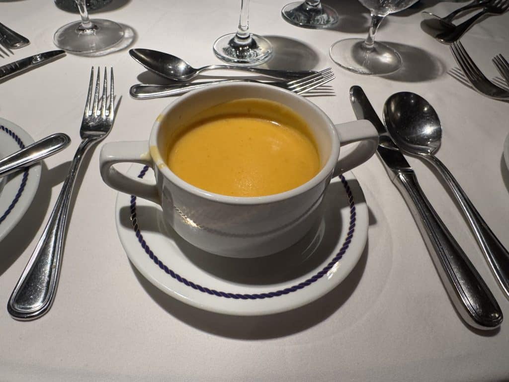 A small bowl of pumpkin ginger soup.
