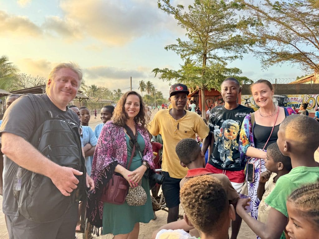 Kate, friends, and a few young men from Madagascar taking a photo together.