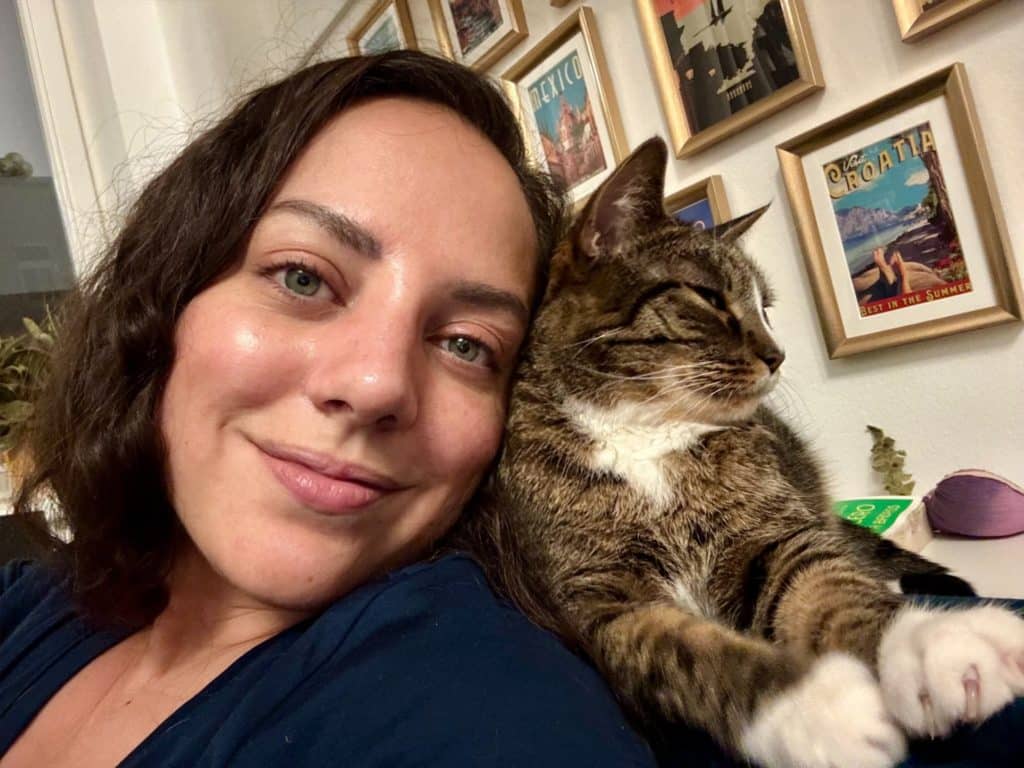 Lewis sitting behind Kate's shoulder pressed up against her face.